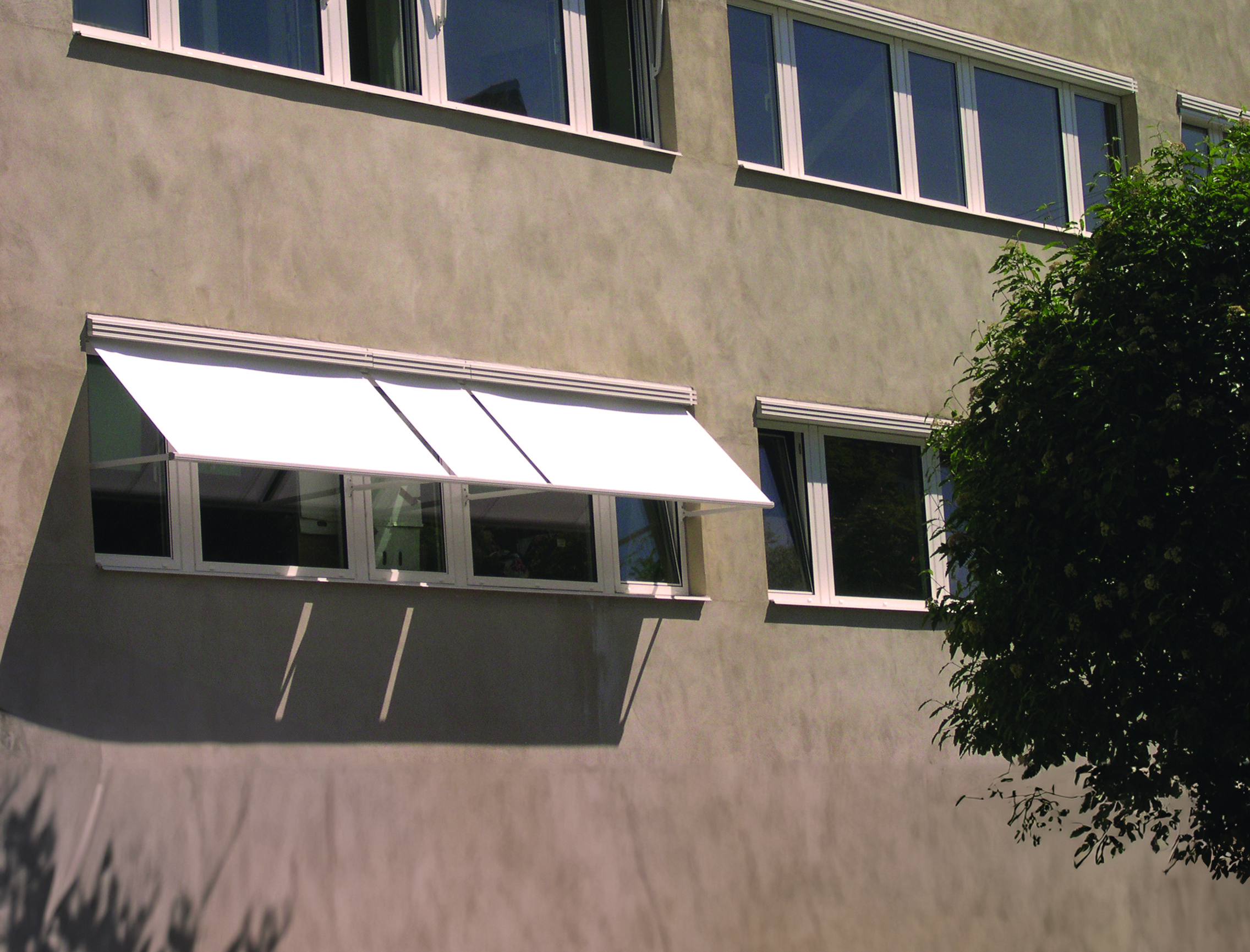 Drop arm awnings